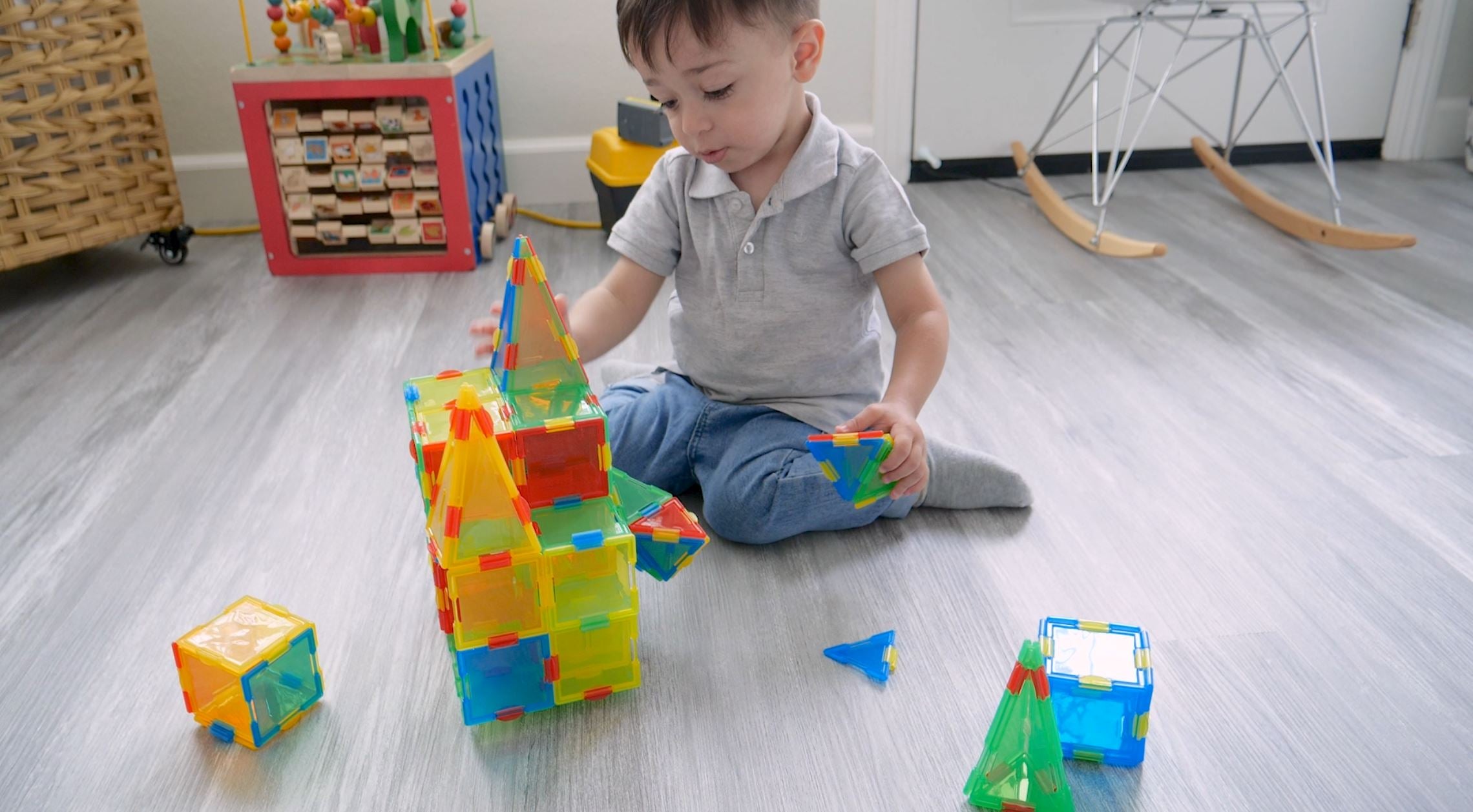 Load video: Little boy playing with Techno Tiles